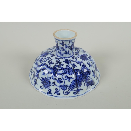 35 - A Chinese blue and white porcelain stem bowl with lobed rim, decorated with phoenix and lotus flower... 