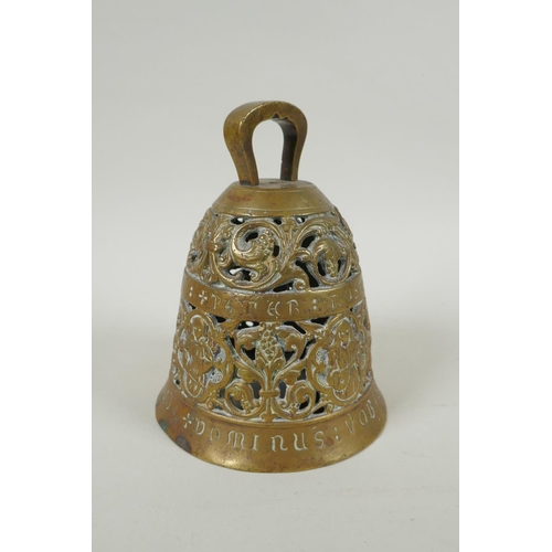 36 - An antique pierced bronze prayer bell decorated with depictions of angelic musicians and Catholic ap... 