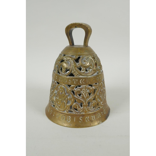 36 - An antique pierced bronze prayer bell decorated with depictions of angelic musicians and Catholic ap... 