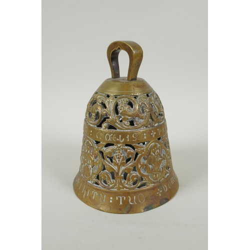 36 - An antique pierced bronze prayer bell decorated with depictions of angelic musicians and Catholic ap... 