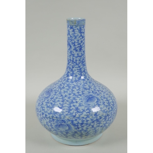 38 - A C19th Chinese blue and white porcelain bottle vase with scrolling floral decoration, AF repair, 32... 