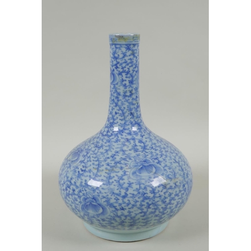 38 - A C19th Chinese blue and white porcelain bottle vase with scrolling floral decoration, AF repair, 32... 