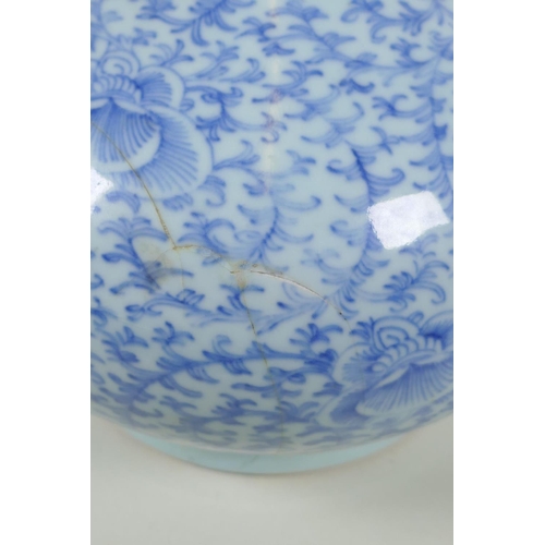 38 - A C19th Chinese blue and white porcelain bottle vase with scrolling floral decoration, AF repair, 32... 