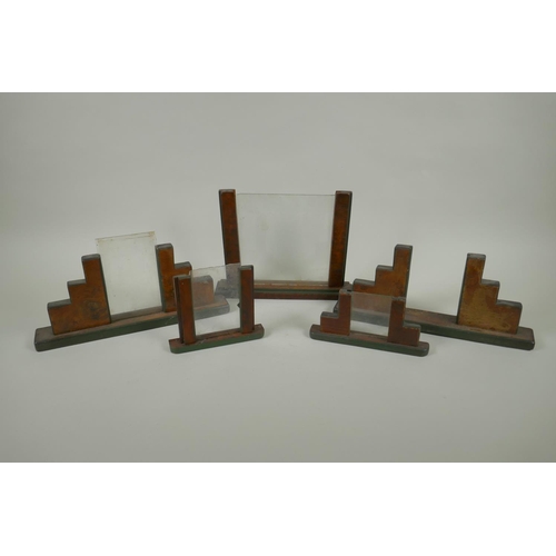 46 - Five early C20th Art Deco walnut photograph frames, largest 26cm wide, 20cm high