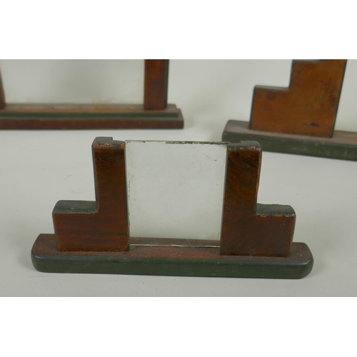 46 - Five early C20th Art Deco walnut photograph frames, largest 26cm wide, 20cm high