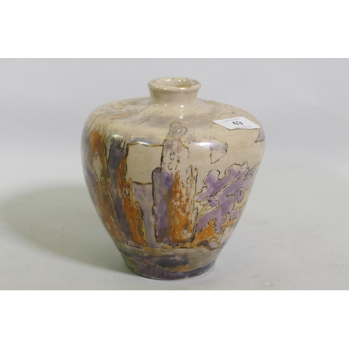 49 - A studio pottery vase, decorated in lustre glaze with a landscape, unsigned, 17cm high