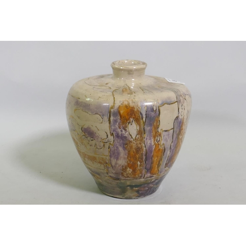 49 - A studio pottery vase, decorated in lustre glaze with a landscape, unsigned, 17cm high