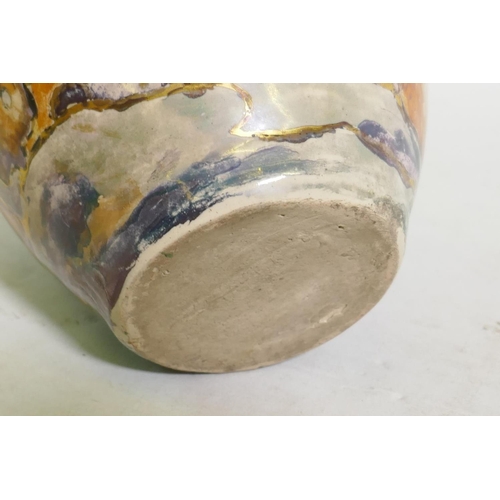 49 - A studio pottery vase, decorated in lustre glaze with a landscape, unsigned, 17cm high