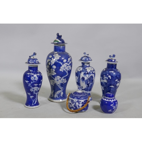 5 - A collection of C19th Chinese blue and white vases with prunus on cracked ice decoration, mismatched... 