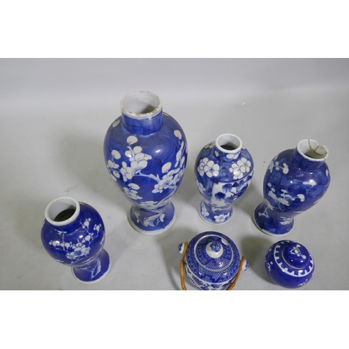 5 - A collection of C19th Chinese blue and white vases with prunus on cracked ice decoration, mismatched... 