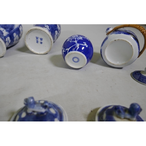 5 - A collection of C19th Chinese blue and white vases with prunus on cracked ice decoration, mismatched... 