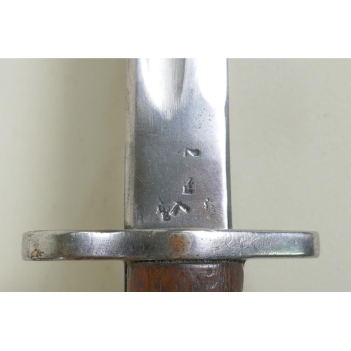 55 - A British P1907 bayonet by Wilkinson, numerous stamps to the blade and scabbard, blade length 43cm