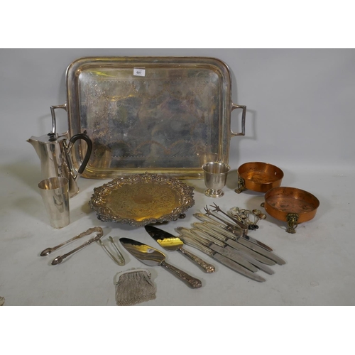 607 - A Sheffield silver plate serving tray, another smaller, silver handled knives and servers, tongs and... 