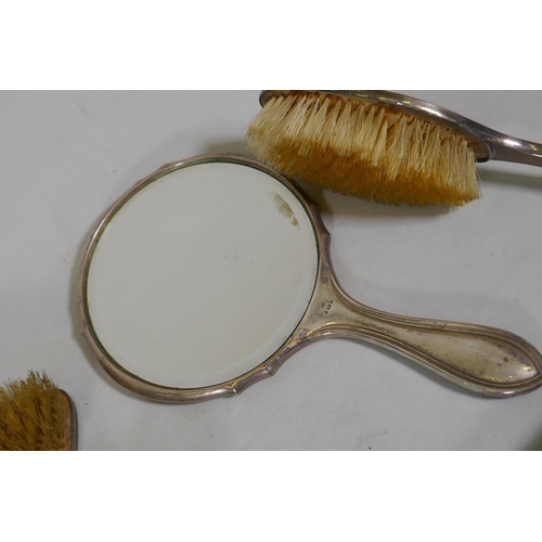 609 - A matched tortoiseshell and silver mounted dressing table set, c1920