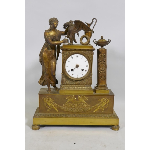 613 - A C19th French Empire style ormolu mantel clock, with classical draped figure and orament, the ename... 