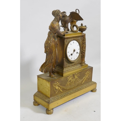 613 - A C19th French Empire style ormolu mantel clock, with classical draped figure and orament, the ename... 