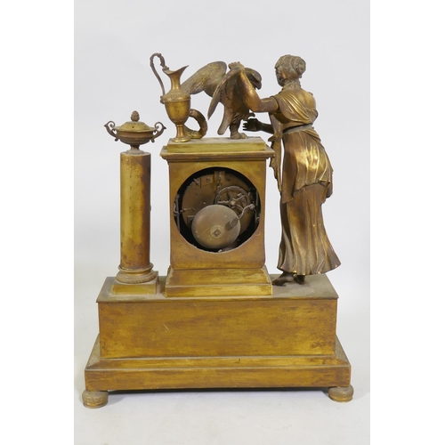 613 - A C19th French Empire style ormolu mantel clock, with classical draped figure and orament, the ename... 