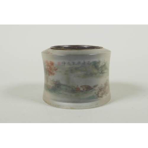 617 - A Chinese reverse painted glass archers thumb ring decorated withe a riverside landscape, and a whit... 