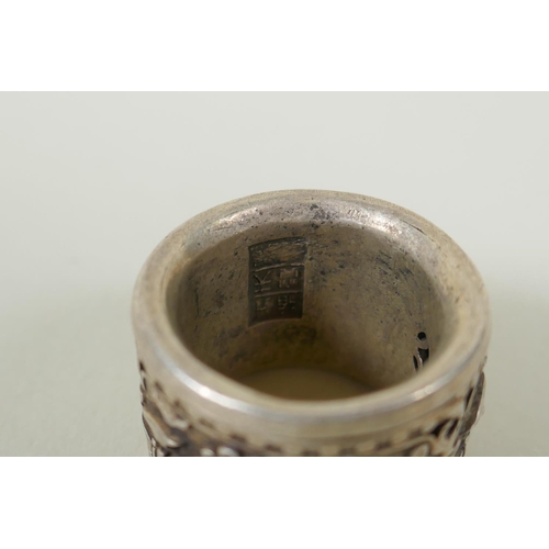 617 - A Chinese reverse painted glass archers thumb ring decorated withe a riverside landscape, and a whit... 