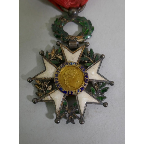 629 - A French Legion d'Honneur with ribbon, enamel AF, a Croix de Merite Agricole with officer's ribbon, ... 