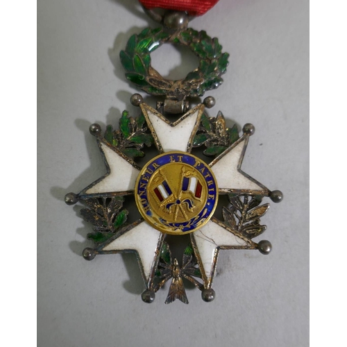 629 - A French Legion d'Honneur with ribbon, enamel AF, a Croix de Merite Agricole with officer's ribbon, ... 