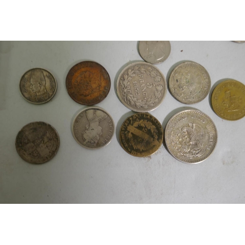 631 - A collection of antique coins and commemorative medals, 1947 Mexican silver five pesos and one peso ... 