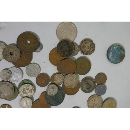 631 - A collection of antique coins and commemorative medals, 1947 Mexican silver five pesos and one peso ... 