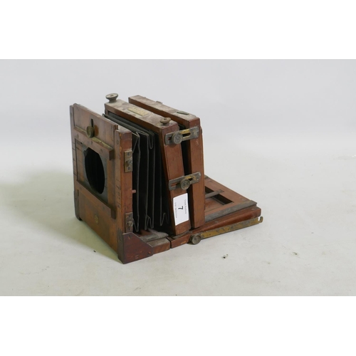 7 - E & T Underwood, Birmingham, a mahogany cased plate camera, retailed by Benetfink & Co, 17 x... 