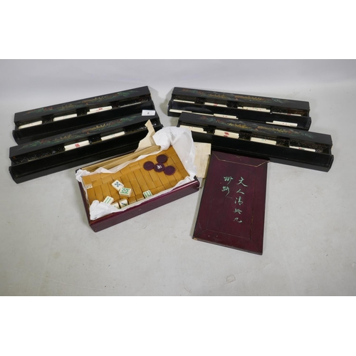 8 - A vintage Mah-Jong set with bamboo and ivorine tiles, and four lacquered counter trays, 41cm long