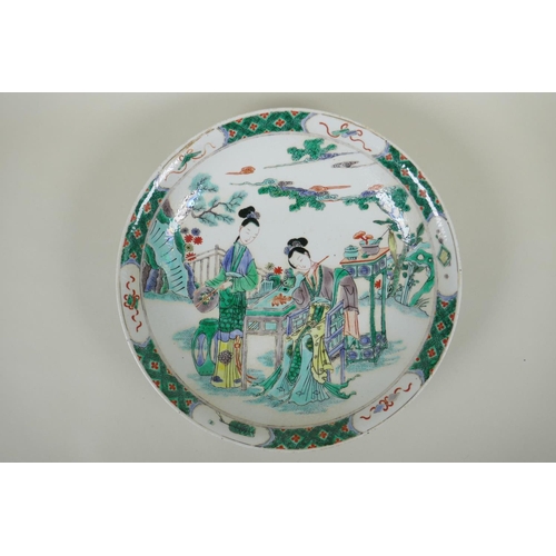 81 - A Chinese KangXi style famille verte porcelain charger decorated with women painting, mark to base, ... 