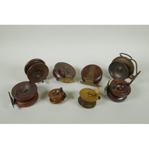 82 - Eight antique wood and brass fly fishing reels