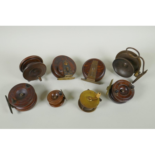 82 - Eight antique wood and brass fly fishing reels