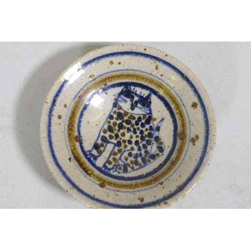 83 - Bryan Newman for Aller Pottery, a small dish with cat decoration, 15cm diameter