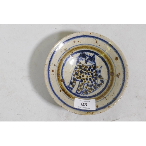 83 - Bryan Newman for Aller Pottery, a small dish with cat decoration, 15cm diameter