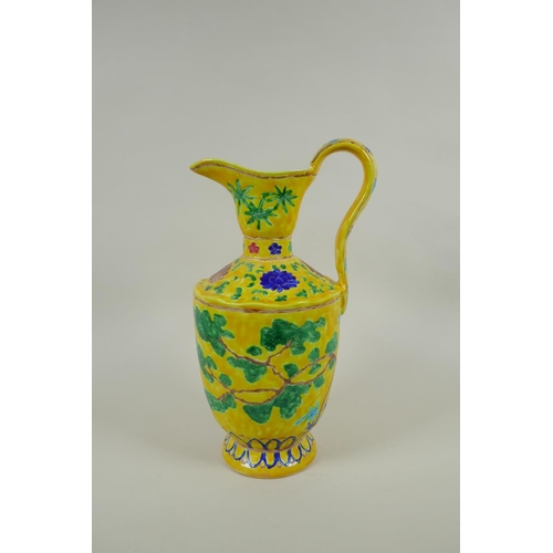 85 - A Chinese yellow ground porcelain fahua ewer decorated with prunus blossom and cypress trees, 32cm h... 