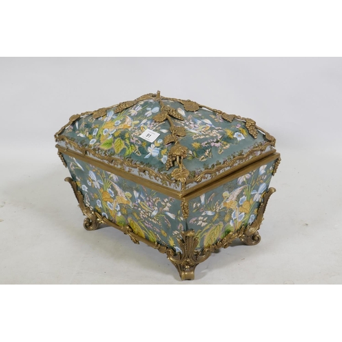 91 - A porcelain casket decorated with exotic birds and brass mounts with grape and vine detail, 37 x 27 ... 