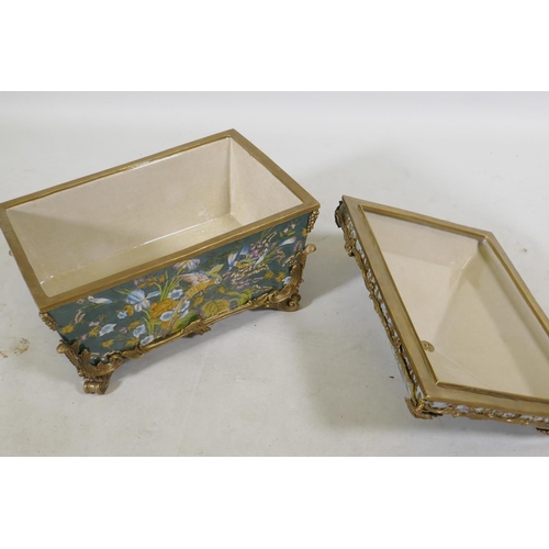 91 - A porcelain casket decorated with exotic birds and brass mounts with grape and vine detail, 37 x 27 ... 