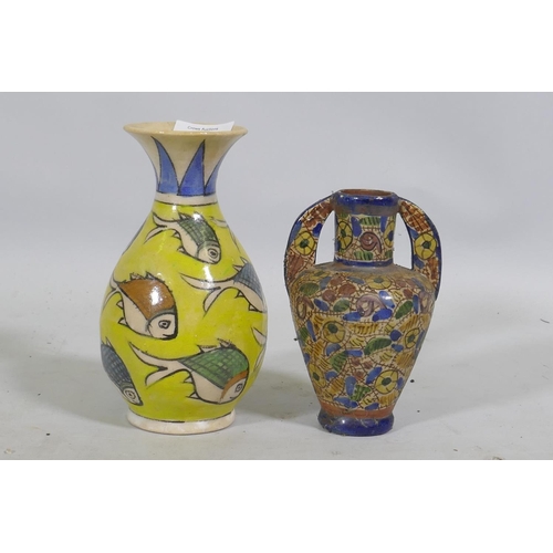 92 - An Eastern ceramic vase with Iznik decoration and a smaller vase, 18cm high