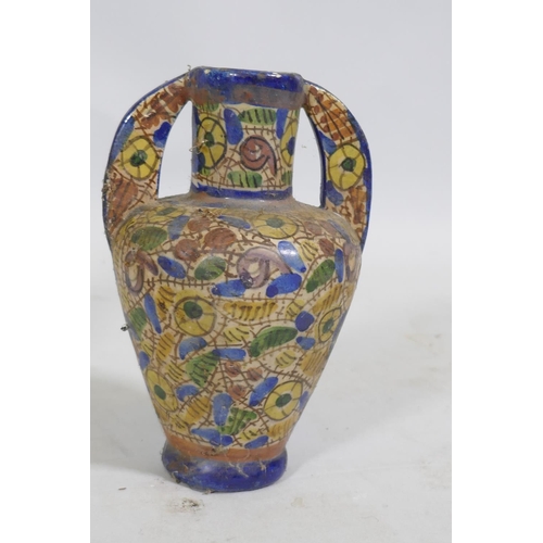 92 - An Eastern ceramic vase with Iznik decoration and a smaller vase, 18cm high