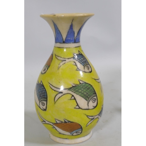 92 - An Eastern ceramic vase with Iznik decoration and a smaller vase, 18cm high