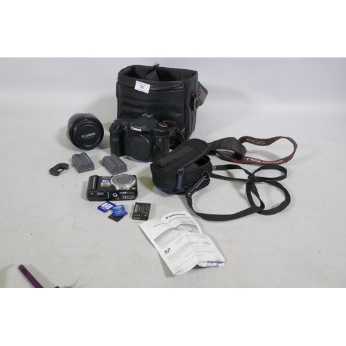 98 - A Canon EOS 40D DLSR camera with EFS 17-85mm lens, batteries and case, and a Panasonic Lumix DMC-TX8... 