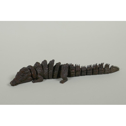 99 - A Japanese Jizai style bronze okimono crocodile, 20cm long