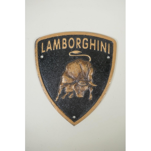 106 - A painted cast iron 'Lamborghini' plaque, 19 x 22cm