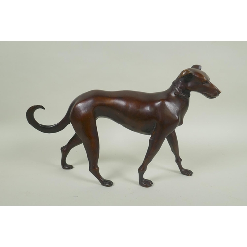 107 - A filled bronze figure of a greyhound, 32cm long