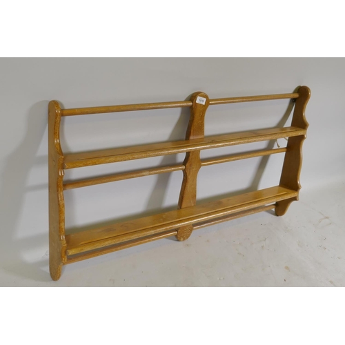 1078 - An Ercol mid century beechwood hanging open plate rack