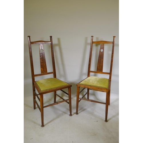 1079 - A pair of C19th Art Nouveau Liberty style oak side chairs