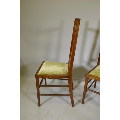 1079 - A pair of C19th Art Nouveau Liberty style oak side chairs