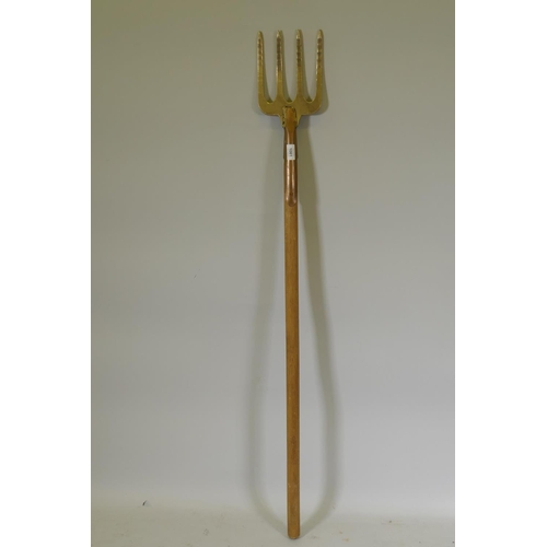 1081 - An artisan constructed copper and bronze garden fork, stamped PKS