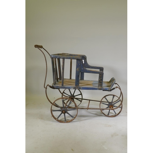 1082 - A Victorian painted pine and wrought iron pram, 80cm high x 90cm long