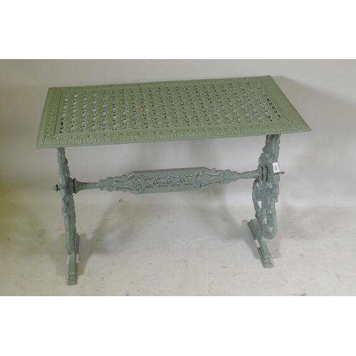 1086 - Painted metal garden table, raised on pierced end supports, 90 x 50 x 68cm